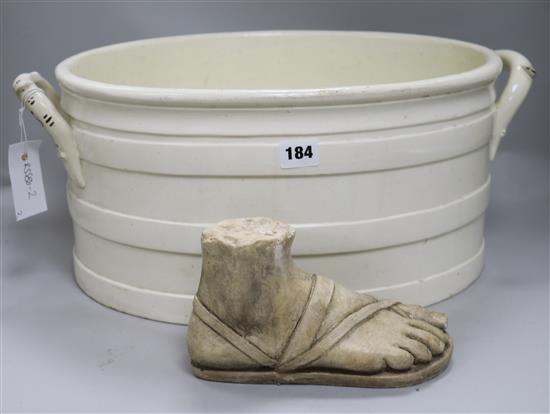 A Victorian two handled footbath and a plaster foot